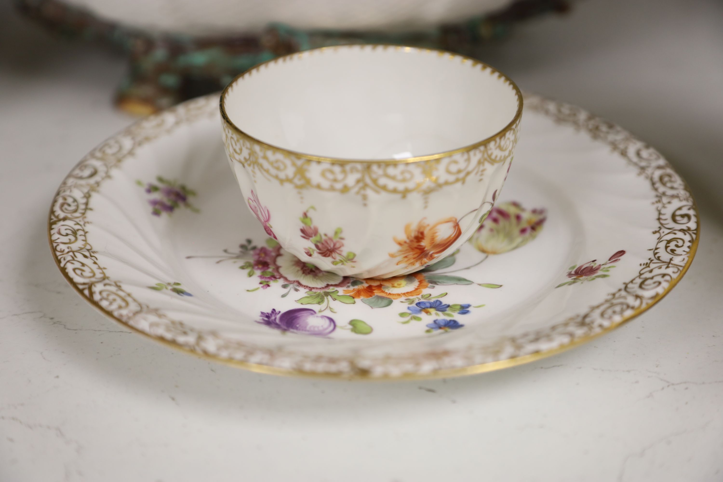 A Dresden-style pierced oval flower-encrusted bowl with branch feet and handles and a Dresden part tea service (15-pce)